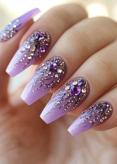 Elegant lavender coffin nails adorned with rhinestones, showcasing stunning nail art design.