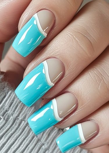 Elegant aqua blue and nude two-tone manicure with glossy finish on square nails.