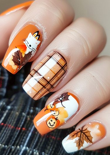 Fall-themed nail art featuring foxes, pumpkins, and autumn leaves in warm colors.