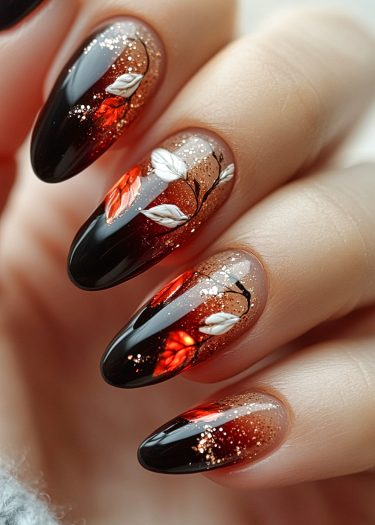 Elegant autumn-themed nail art with ombre effect, featuring leaves and glitter accents.