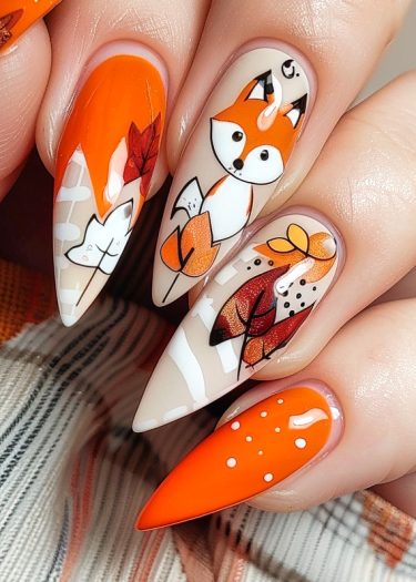 Autumn-themed stiletto nails with fox design and colorful leaf accents for seasonal flair.