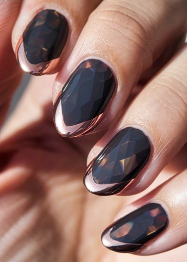 Elegant black almond-shaped nail art with faceted design and rose gold metallic accents.