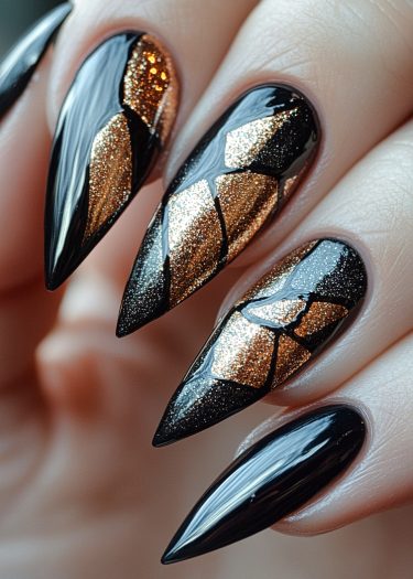 Stunning black and gold stiletto nails featuring glamorous glittery mosaic designs.