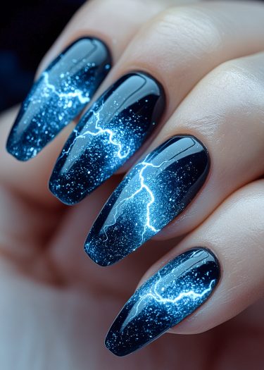 Elegant black almond nails featuring stunning electric blue lightning art and sparkling glitter accents.