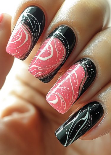 Artistic black and pink marble nails with glitter and intricate designs for a modern look.