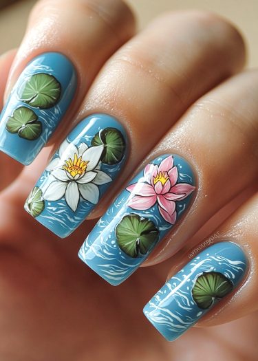 Serene blue water lily nail art design featuring vibrant flowers and lily pads.