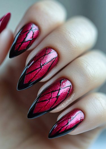 Intricate magenta almond nails with bold black geometric designs, showcasing stunning nail art elegance.