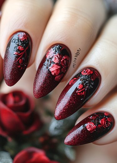 Elegant burgundy floral nail art with roses and glitter accents for a luxurious manicure.