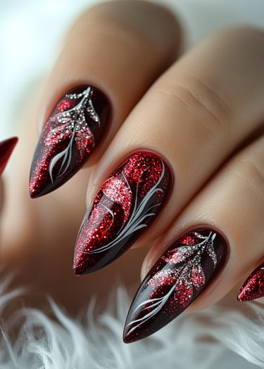 Elegant burgundy glitter nail art with intricate leaf designs for a luxurious manicure look.