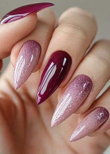 Elegant burgundy ombre nails with glitter for a glamorous and stylish manicure look.