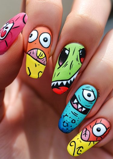 Vibrant cartoon monster nail art featuring unique, playful designs and colorful expressions.