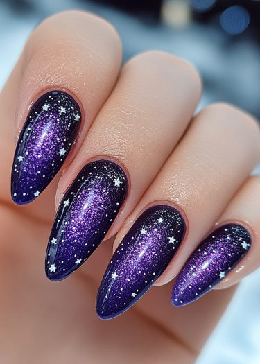 Elegant cosmic gradient nails featuring shimmering stars on a rich violet background.