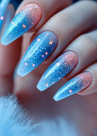 Elegant celestial gradient nails featuring pink to blue ombre and shimmering star embellishments.