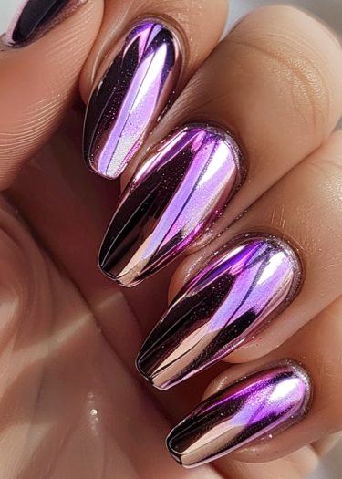 Elegant chrome almond nails in metallic lilac, showcasing a stylish and eye-catching manicure.