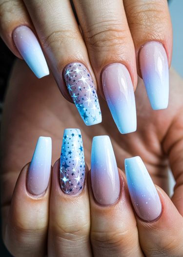 Elegant coffin-shaped nails featuring ombré gradient and starry design, perfect for versatile nail art.