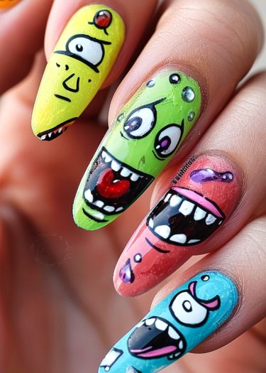 Vibrant monster nail art featuring playful, colorful designs and unique cartoonish faces on long nails.