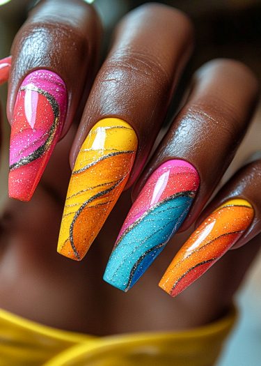 Vibrant coffin-shaped nails with colorful swirling designs and glitter for a stunning nail art look.