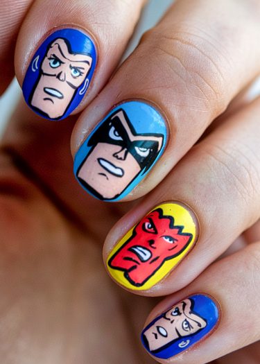 Colorful comic-style nail art featuring vibrant cartoon characters with heroic expressions.