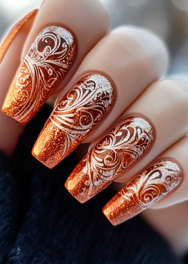 Elegant copper-orange nail art with silver glitter patterns, perfect for sophisticated occasions.