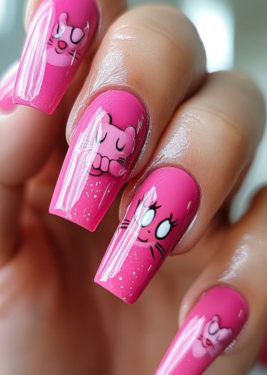 Vibrant pink cat nail art featuring playful designs and glossy finish for stylish elegance.