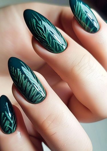 Elegant dark green nail art with intricate leaf designs for a sophisticated manicure.