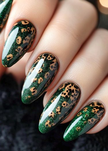 Glamorous dark green leopard print nails with sparkly finish in elegant almond shapes.