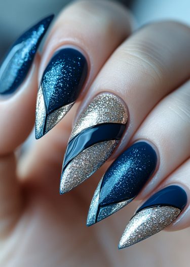 Elegant stiletto nails in deep blue and silver glitter showcase modern nail art design.