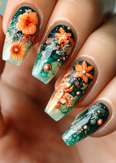 Elegant deep green floral nail art with vibrant orange flowers and rose gold accents.