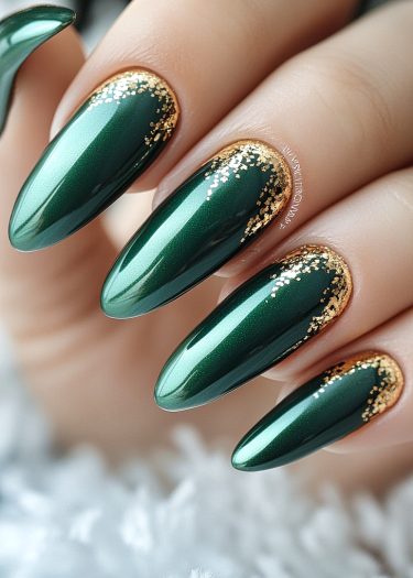 Elegant deep green nails with gold glitter accents, showcasing luxurious manicure and stylish design.