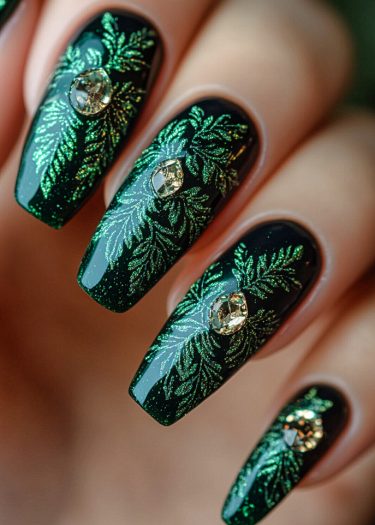 Elegant deep green leaf nail art with shimmering details and glamorous gems for sophisticated style.