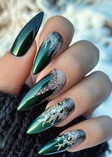 Elegant deep green metallic stiletto nails adorned with silver accents and sparkling rhinestones.