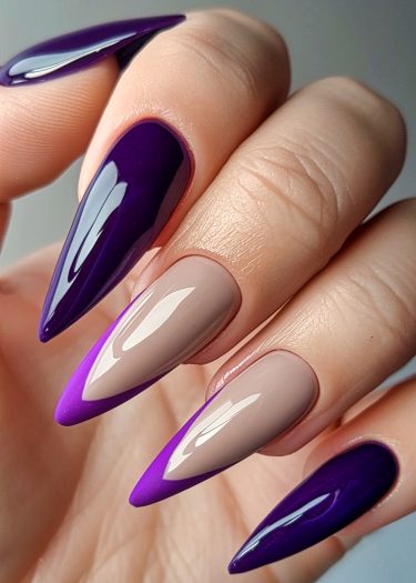 Stiletto nail art featuring deep purple and taupe gradient for a bold, elegant look.