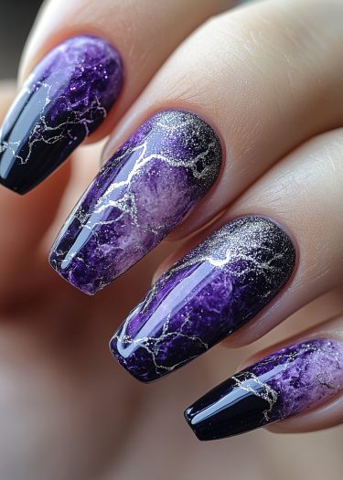 Elegant deep purple and black manicure with intricate silver veins.