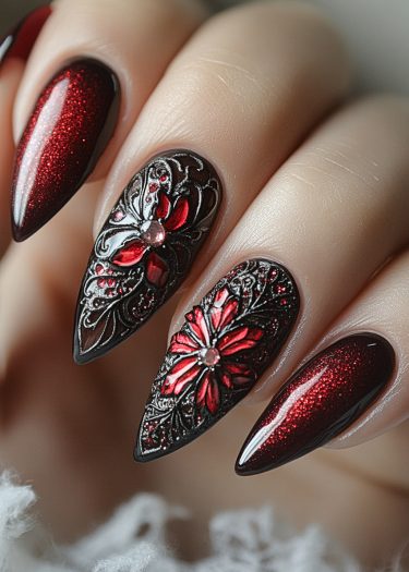 Elegant deep red floral nail art with rhinestones on long almond-shaped nails.