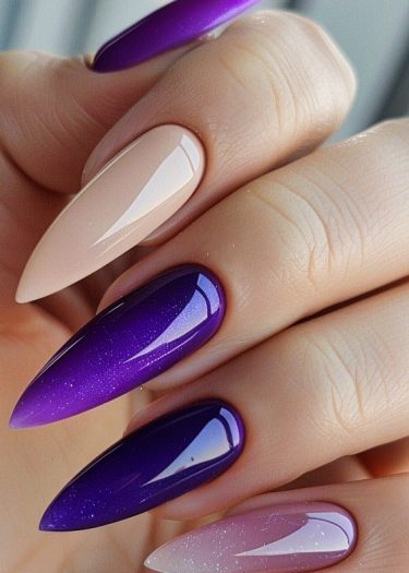 Chic almond manicure with vibrant purple, subtle beige, and glittery gradients for a stylish look.