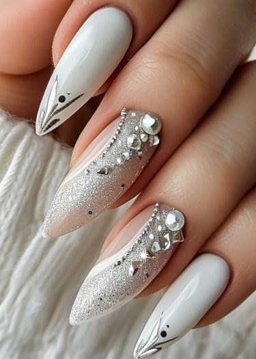 Elegant almond nail designs featuring glossy white, silver sparkles, and dazzling rhinestone embellishments.