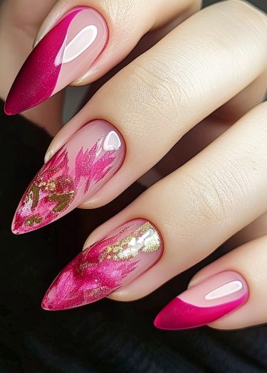 Elegant almond-shaped nails with vibrant pink and gold intricate nail art designs.