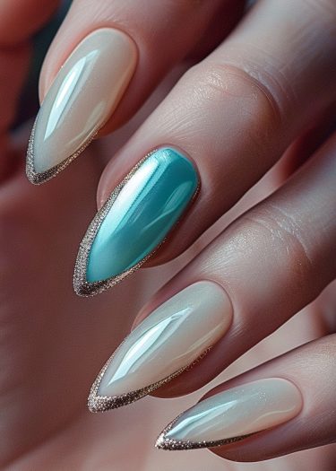 Elegant almond-shaped nails with glossy finishes and glitter tips, featuring a turquoise accent.