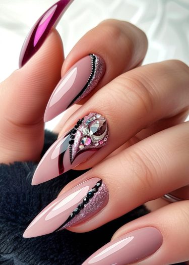 Elegant almond-shaped nails with intricate rhinestone and glitter nail art in soft pink and magenta.