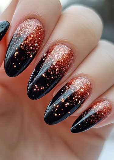 Elegant black and copper nail art with glitter gradient showcasing luxurious nail design and style.