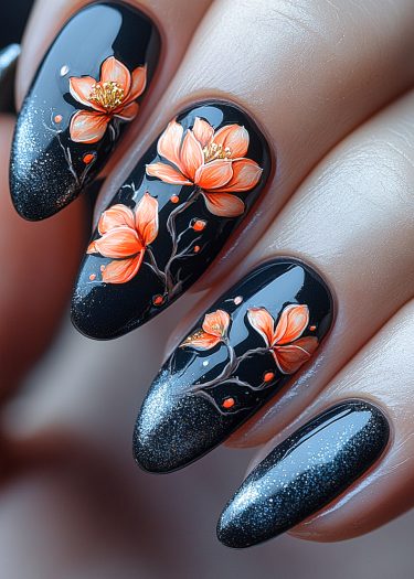 Elegant black floral nail art with vibrant orange flowers and shimmering galaxy background.