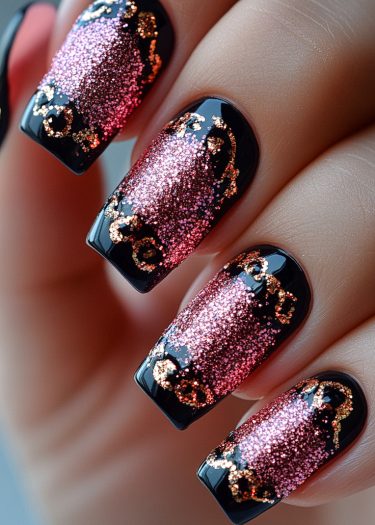 Elegant black nail art featuring pink glitter and gold accents for a glamorous look.