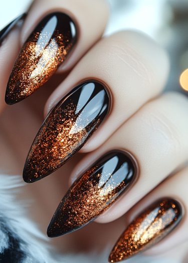 Elegant black stiletto nails with copper glitter create a luxurious and glamorous manicure.