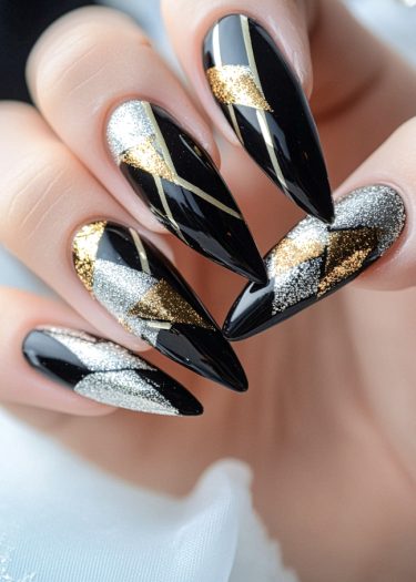 Elegant black nail art with gold and silver accents showcases modern geometric designs.