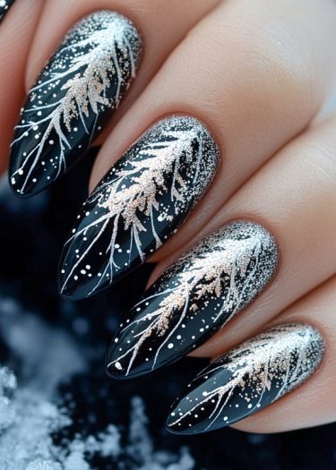 Elegant black nail art with shimmering winter patterns and pointed almond shapes.