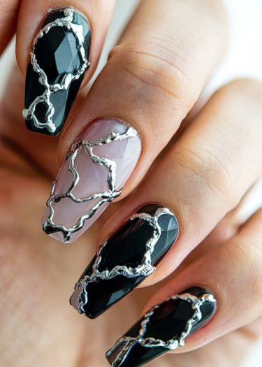 Elegant black and pink coffin nail art with metallic designs for a sophisticated look.