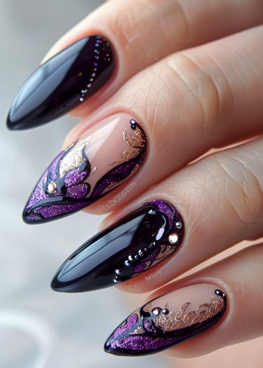 Stunning almond-shaped nail art featuring black, purple, and gold glitter for a luxurious look.