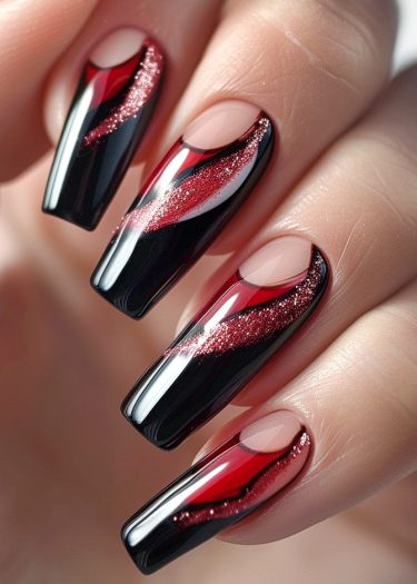 Elegant black and red nail art featuring intricate designs and glittery accents for a dramatic look.