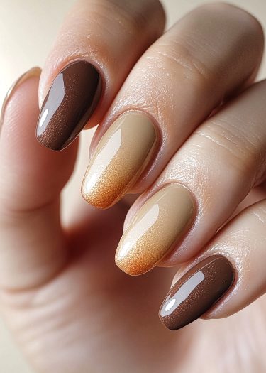 Chic brown ombre manicure showcasing elegant almond-shaped nails with a glossy finish.