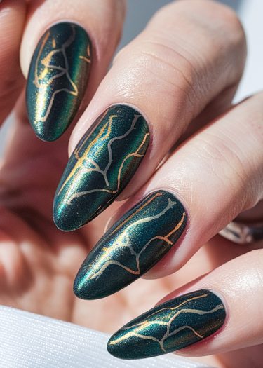 Sophisticated almond-shaped dark green nail art with metallic gold and silver designs.